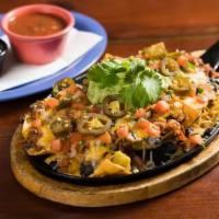 NACHOS · Guacamole, black beans, pico, cheese, pickled jalapeno with sour cream and salsa. Gluten free.