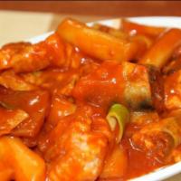 Tteokbokki · Rice and fish cakes, onions, stir-fried in a Korean red pepper sauce topped with mozzarella ...