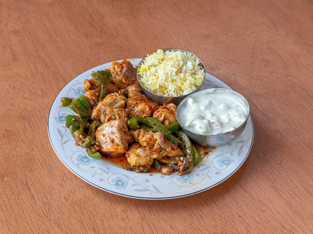 Chili Chicken · Stir fried chicken and vegetables coated in our house chili sauce. This dish is spicy.