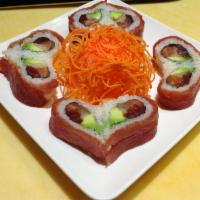 R86. Valentine Roll · Tuna, salmon, yellowtail and avocado topped with tuna.