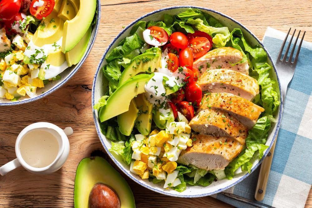 Chicken Cobb Salad · Lettuce with bacon turkey, tomato, avocado, boiled egg and grilled chicken.