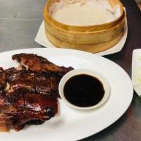 Half peking duck · Half Sliced duck slowly roasted with soy and bbq flavor sauce. Served with 4 pancake wraps a...