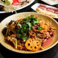 Mixed Spicy Dry Hotpot · Mixed spicy dry hotpot with fatty beef, sausages, fish cakes, lotus root, variety of mushroo...