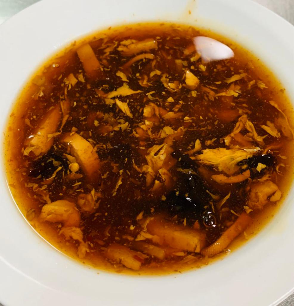 Hot and Sour Soup · A traditional Chinese soup with broth, eggs, tofu and vegetables. Spicy.