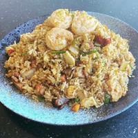 Singapore Fried Rice · New delicious fried rice mixed with shrimps, roast pork and chicken in curry flavor. Spicy.