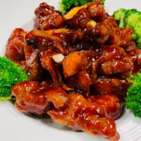 Orange Chicken · Dark meat. Chicken tossed in a sweet and spicy orange sauce. Served with choice of rice.