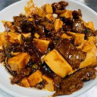 Beef with bean curd · Served with rice.