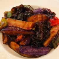 Eggplant in Garlic Sauce · Stir fried eggplant in a garlic sauce. Served with choice of rice. Vegetarian.