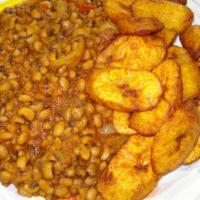 Beans and Fried Plantains with Chicken · Palm-oil cooked beans served with fried plantains and chicken.