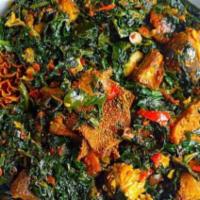 Efo Riro · Vegetable soup made with finely shredded spinach. Includes beef and tripe.