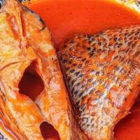 Fresh Tilapia Fish Stew · Fresh tilapia steamed in tomato based Nigerian spiced stew.
