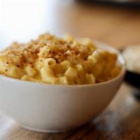 Mac & Cheese · Freshly made Three cheese Mac and Cheese, topped with roasted breadcrumbs