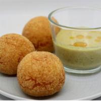 Elarji Polenta Balls · Creamy homemade Georgian cheese polenta balls with walnut garlic sauce