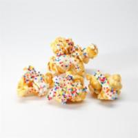 Birthday Cake Popcorn · Vanilla caramel drizzled with vanilla white chocolate. Topped with confetti sprinkles.