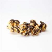 Salted Dark Chocolate Caramel Popcorn · Rich and indulgent caramel drizzled with dark chocolate chocolate and sea salt. Our top sell...