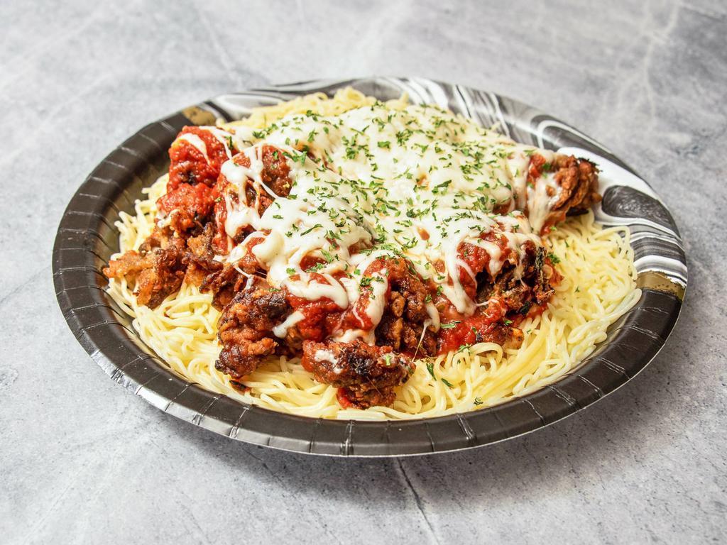 Un-Chicken Parm  · Breaded and fried un-chicken topped with house made plum tomato garlic sauce and vegan mozzarella cheese served on top of angel hair pasta. 