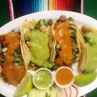 Tacos · Choice of meat, onion, cilantro and choice of red or green sauce.