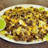 Asada Fries · French fries with carne asada, cheese and sour cream, guacamole sauce.