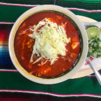 Pozole · Soup with pork, hominy, chips, lettuce and onion.