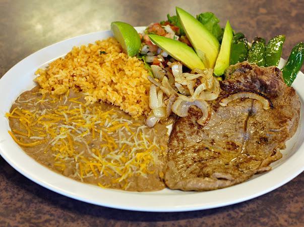 Carne Asada Plate · Steak served with avocado, grilled onion, chile guero, pico de gallo and a side tortillas, rice and beans.