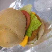 Vegan Chicken Sandwich Deluxe   · Vegan mayonnaise, pickle, vegan chicken patty, lettuce, tomato, diaya cheddar and served on ...