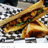 Miami Spice Sandwich · Original peanut butter, apricot jelly, siracha, basil, chicken, and curry on challah bread.