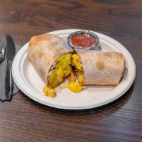 Breakfast Burrito  · Whole wheat wrap with eggs, cheese, and seasoned potatoes. With a choice of adding braised b...