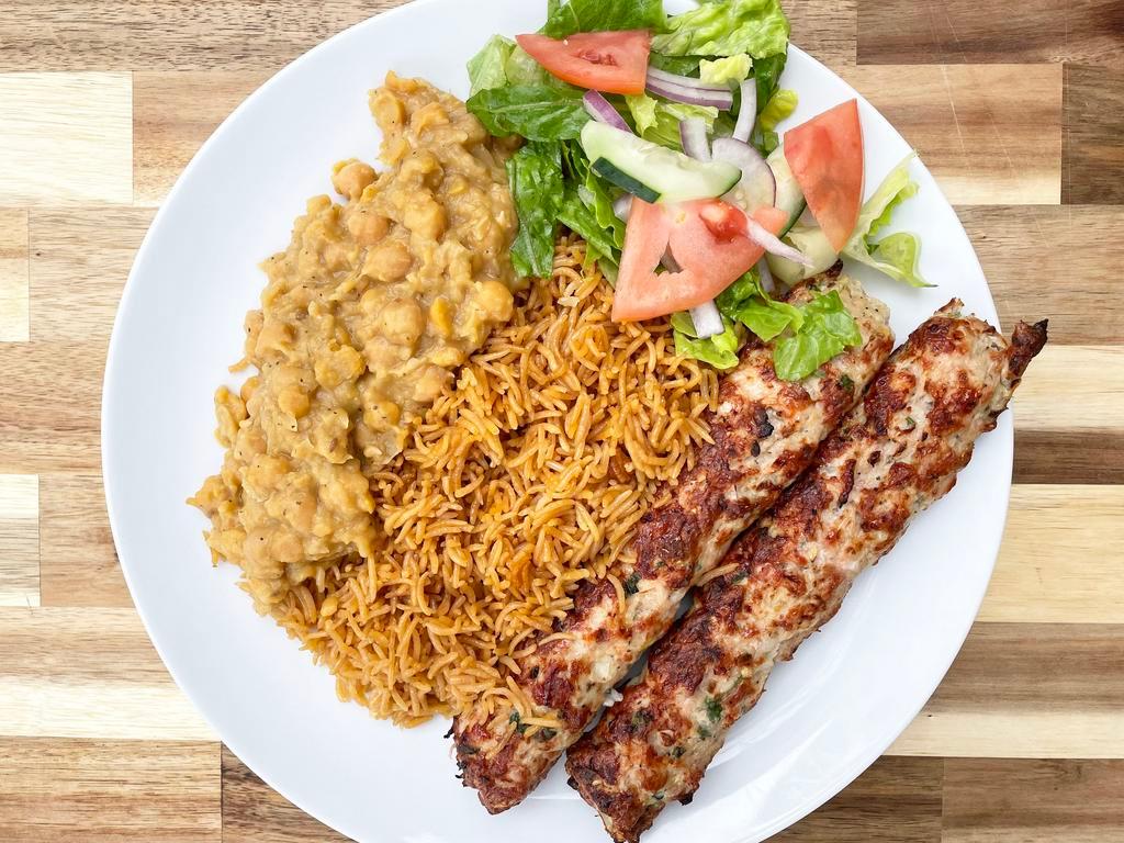 Chicken Seehk Kabob Platter · Ground Chicken with traditional spices, slow cooked on a skewer to perfection. Comes with rice, chana, salad, and naan 