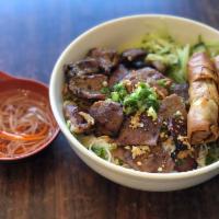 32. BBQ Pork & Egg Roll with Vermicelli · *Contains Peanuts* Flame grilled BBQ pork & deep fried egg roll topped w/ peanuts, scallion,...
