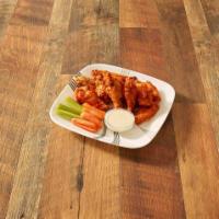 Brewer's Wings · 10 crispy breaded wings tossed in choice of buffalo, spicy BBQ, BBQ, spicy Thai or garlic an...