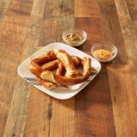 Pretzels and Beer Cheese · Warm bavarian pretzel stick topped with olive oil and served with homemade beer cheese.