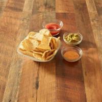Chips and Dip Trio · A basket of warm, crispy tortilla chips served with homemade salsa, homemade beer cheese and...