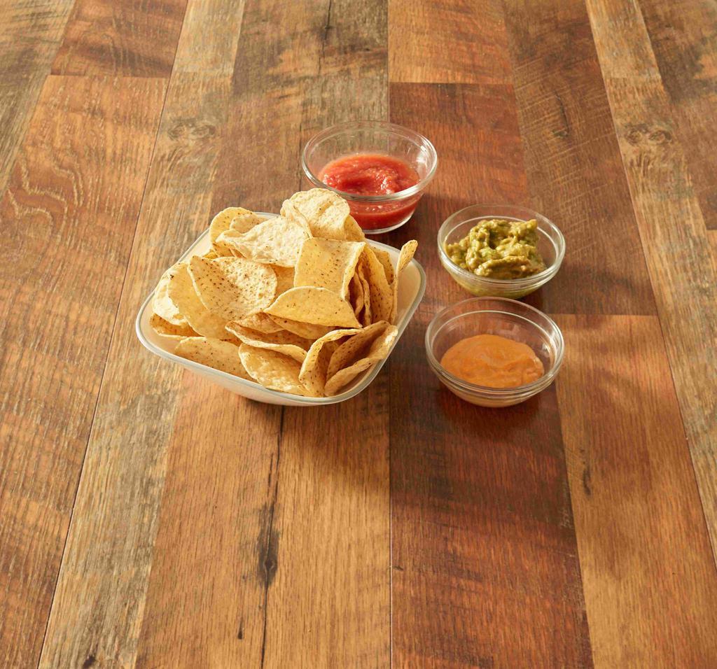 Chips and Dip Trio · A basket of warm, crispy tortilla chips served with homemade salsa, homemade beer cheese and homemade guacamole.