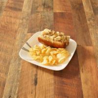 The German · 1/4 lb. brat marinated in seasonal craft beer, served on a toasted bavarian pretzel bun with...