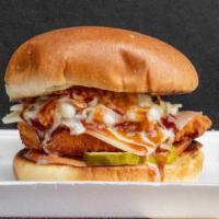 Mississippi Flyer · Fried chicken breast, Swiss cheese, coleslaw, tomato, pickles, BBQ sauce served on butter bun.