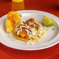 Fish Taco · Cabbage, pico de gallo, cream, and salsa.