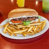 Flaming Steak Dinner · Sandwich with mayo, lettuce, and tomato. Served with French fries, salad, and dinner roll.