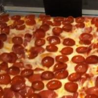 Pepperoni Pizza · Pepperoni, house red sauce topped with creamy mozzarella.