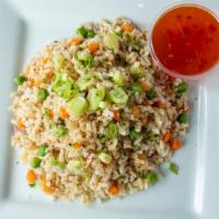 Brown Rice Pilaf · Tender brown rice, with sauteed, peas ,carrots, vegetables, herbs, and spices. gluten free.