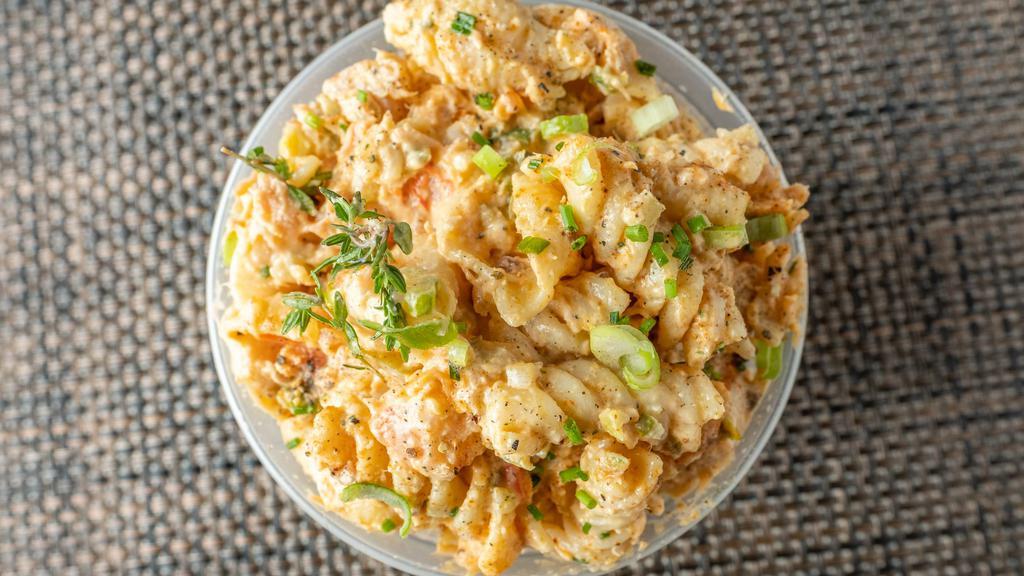 Seafood Pasta Salad · Creamy and delicious crab, salmon and shrimp salad made with seashell pasta, vegetables, herbs and spices. One pint. Add a small stack of wheat crackers for an additional charge. Pasta and crackers contain gluten.