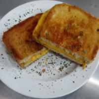 Grilled Cheese Sandwich · Yellow American cheese layered between two slices of buttery grilled white bread.