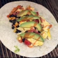 Screaming' Southwest Burrito · 3 eggs, cherry tomatoes, black beans, corn, salsa fresca, hot sauce, avocado, pepper jack ch...