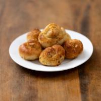 Garlic Knots · Fresh dough, hand-tied and perfect for dipping with fuel marinara.
