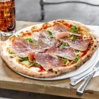 Margherita and Prosciutto Pizza · Italian tomato sauce and fresh mozzarella topped with prosciutto and baby arugula after baki...
