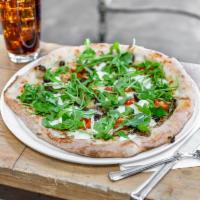 Truffle and Vegetable Pizza · Truffle cream, fresh mozzarella, ricotta, mushrooms, black olives, grape tomatoes and topped...