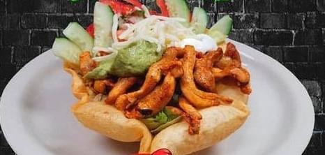 Taco Salad · Crispy fried tortilla filled with romaine lettuce, your choice of meat, beans, cheese, pico de gallo, sour cream, and guacamole.