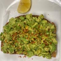 Avocado Toast  · Crusty whole grain toast topped with fresh mashed avocado, olive oil, lemon, red pepper flak...