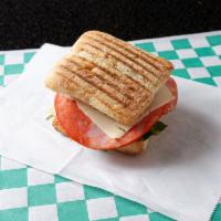 Spicy Italian Ham Panini · Spicy Italian ham with pepper Jack, spinach, roast peppers and onion, tomatoes, and spicy ma...
