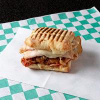 Smoked Turkey and Brie Panini · Smoked turkey and Brie cheese with caramelized onions on ciabatta bread.