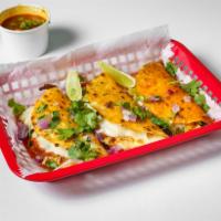 Birria Chicken Taco · 3 chicken tacos with cheese, diced, onions, cilantro and a small cup of consume!